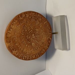 Phaistos Clay disk. Greek art work. Handmade.